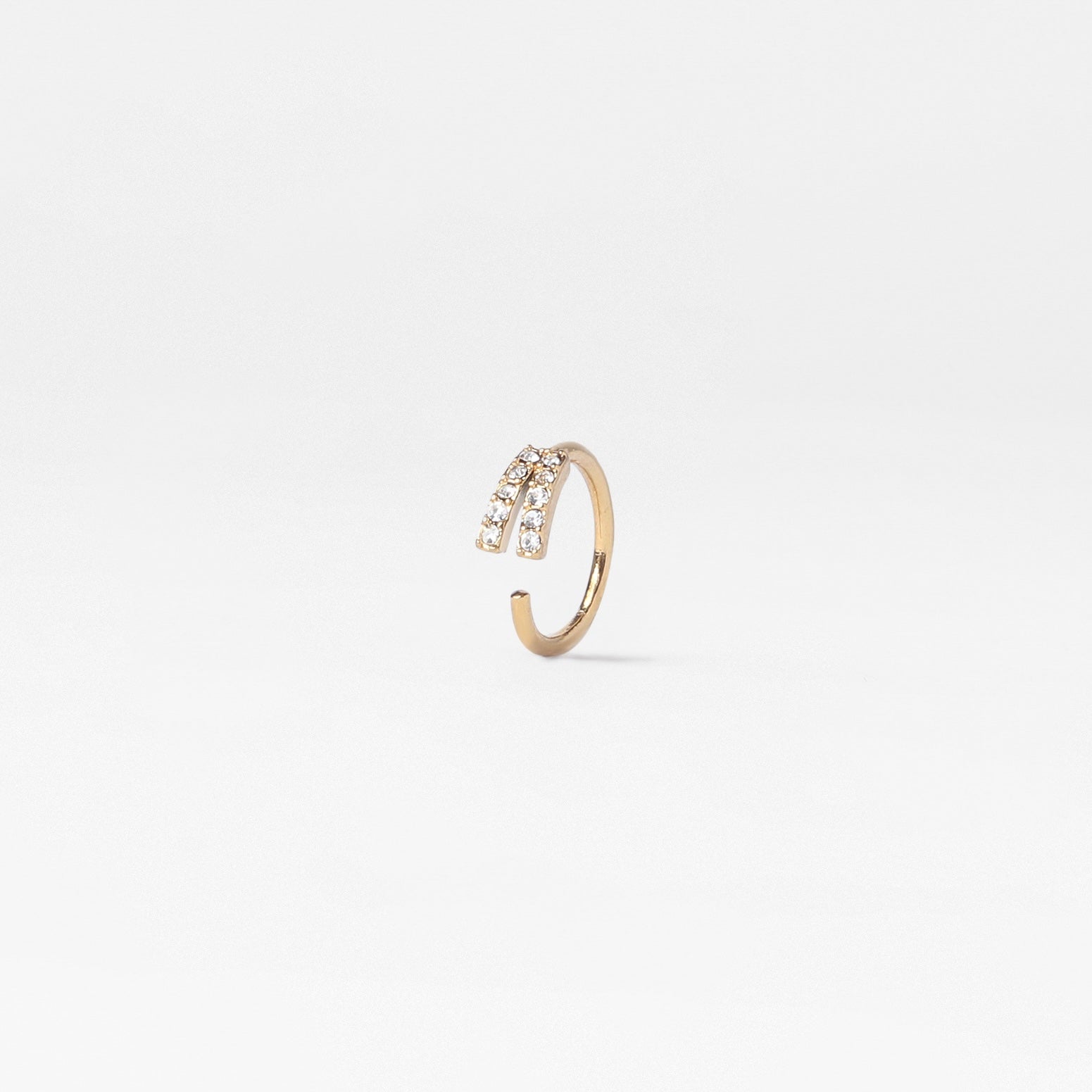 gold wishbone hoop with two lines of sparkly gemstones along the wishbone